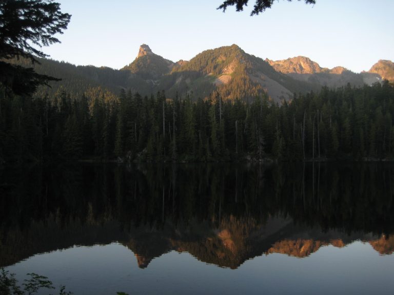 Evening sun lights up Kaleetan Peak reflected in Tuscohatchie Lake