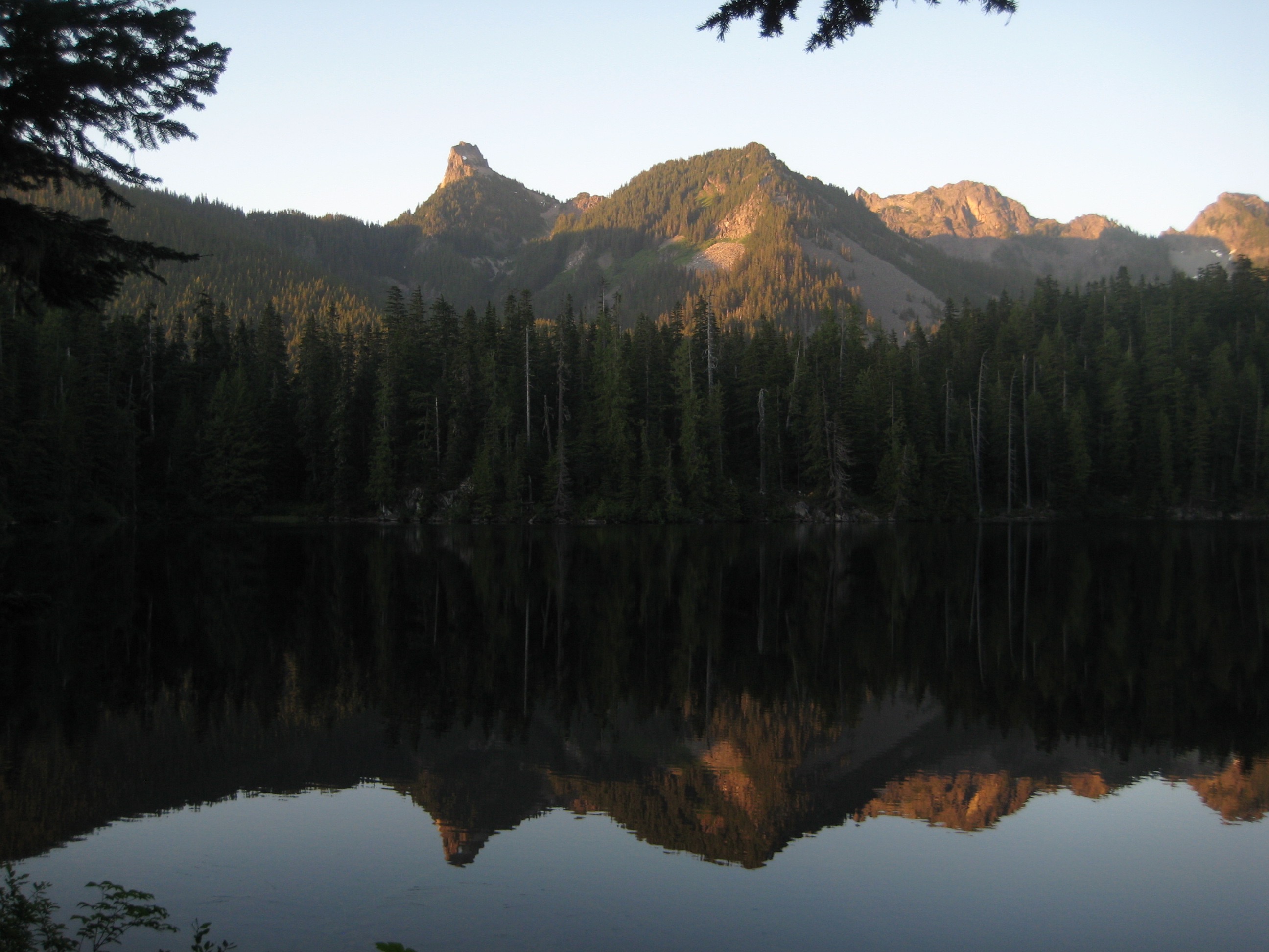Evening sun lights up Kaleetan Peak reflected in Tuscohatchie Lake