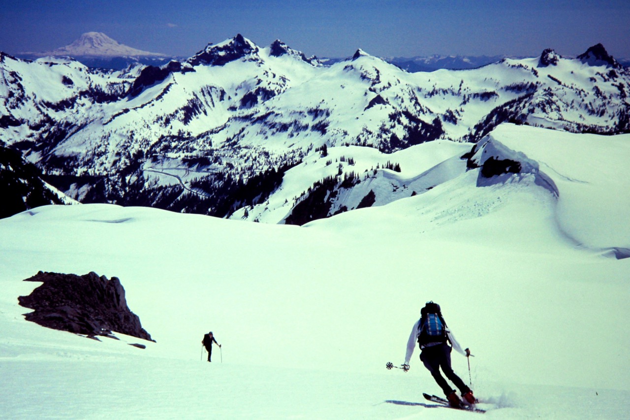 Two backcountry skiers descending the Paradise Glacier on Mt Rainier