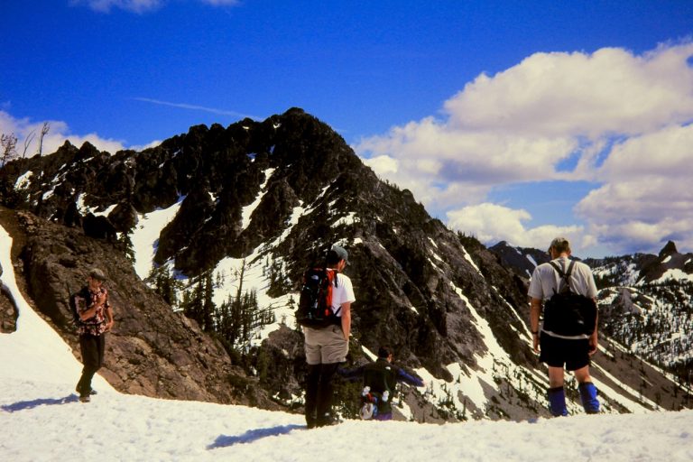 Hikers looking at Bills Peak while standing at Iron Pass