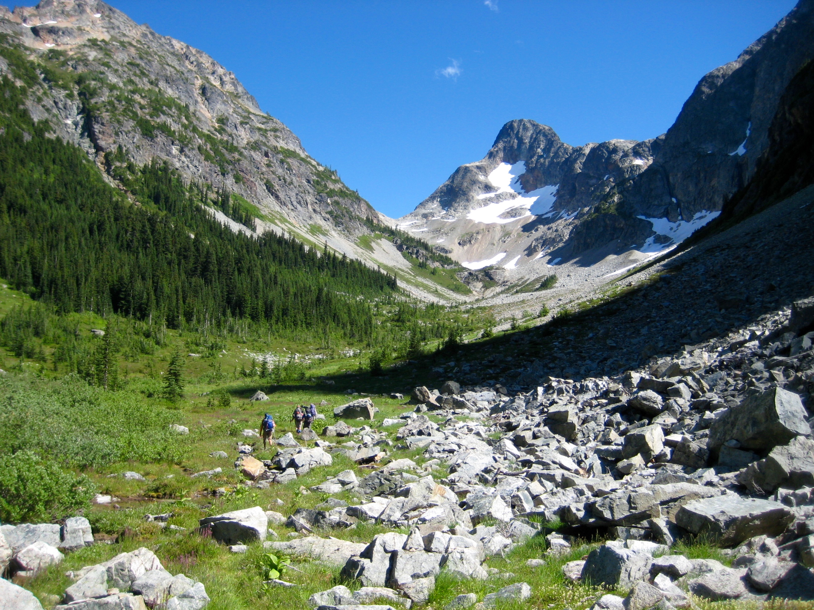 Climbers heading up Fisher Creek Basin with Fisher Peak in the distance