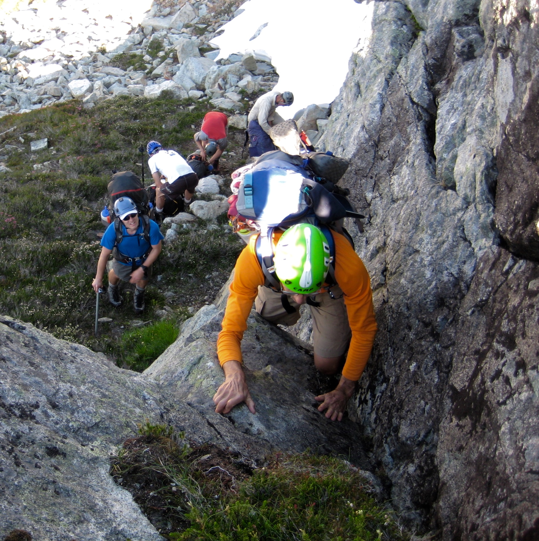 Climbers scrambling up Class 3 step toward Silent Lakes