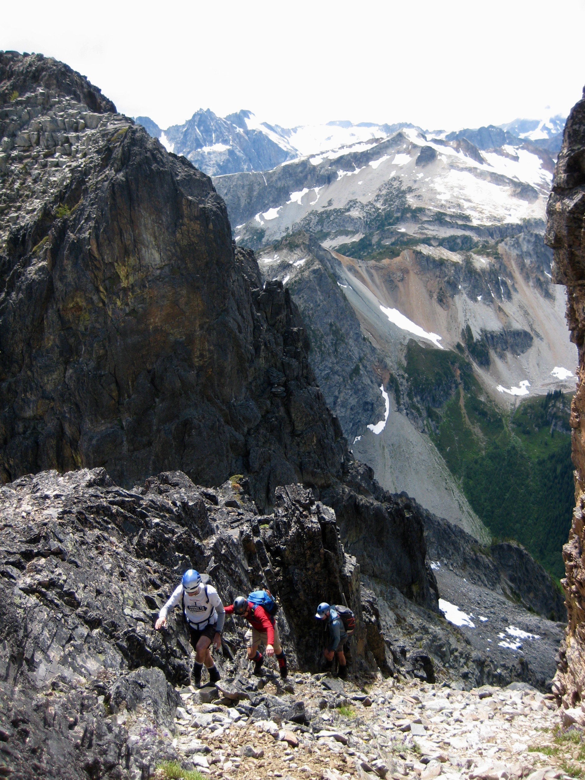 Climbers ascending the Lower Dike Slot under the Summit of Mt Arriva