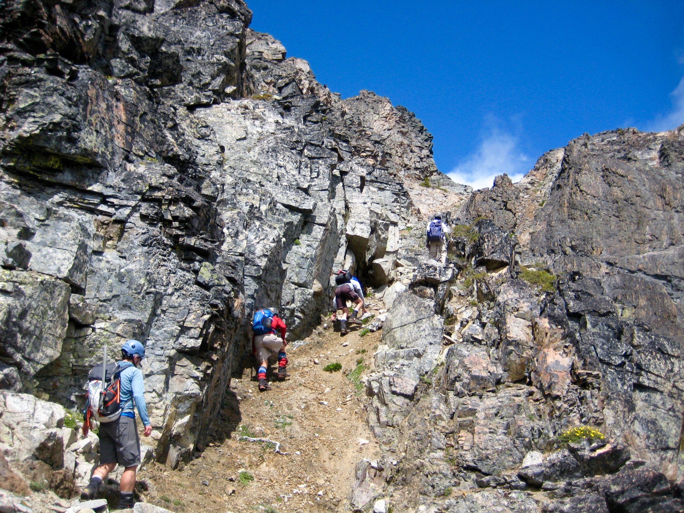 Climbers ascending Middle Dike Slot under the summit of Mt Arriva