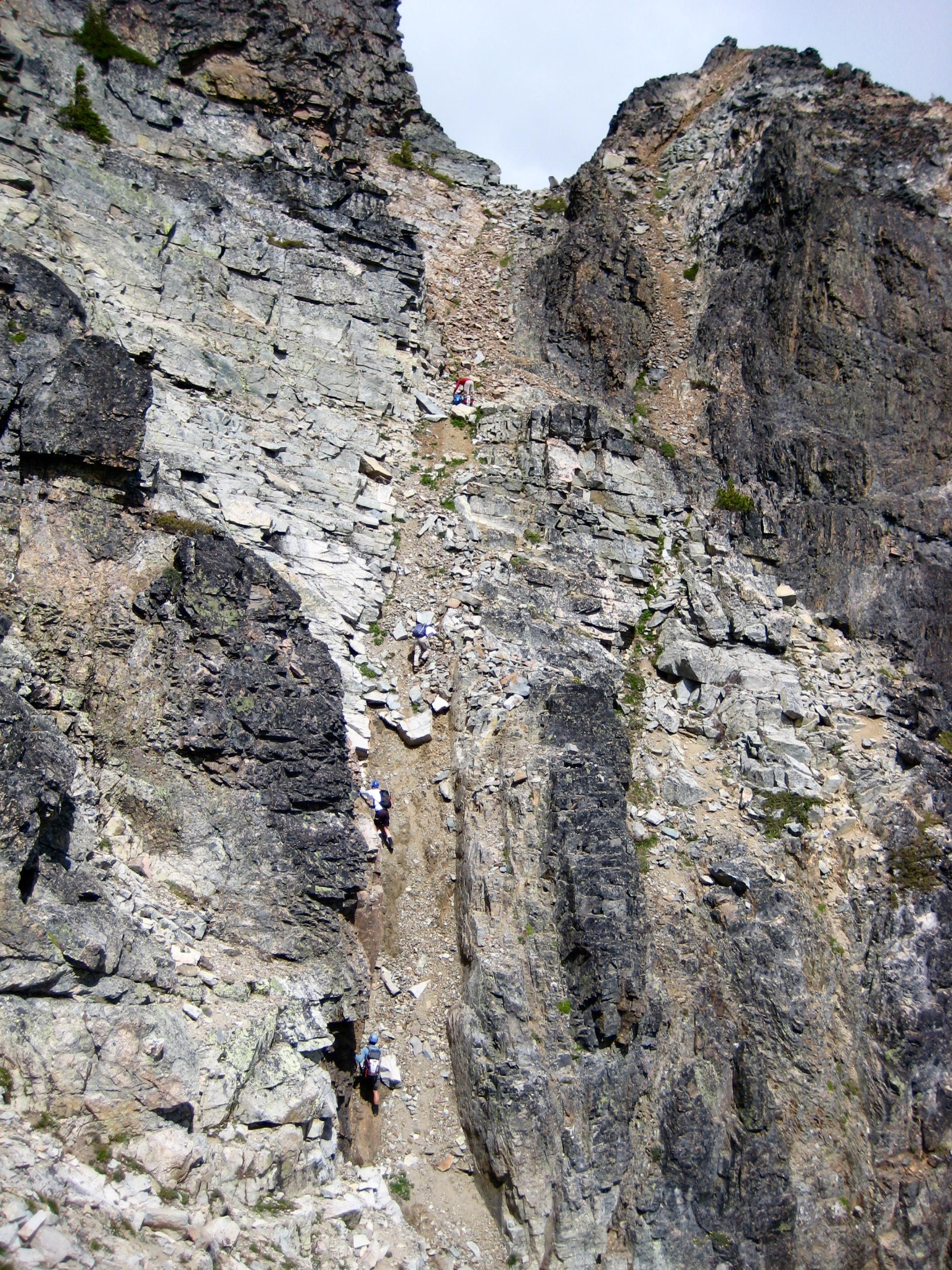 Climbers heading up the Upper Dike Slot towards the summit of Mt Arriva