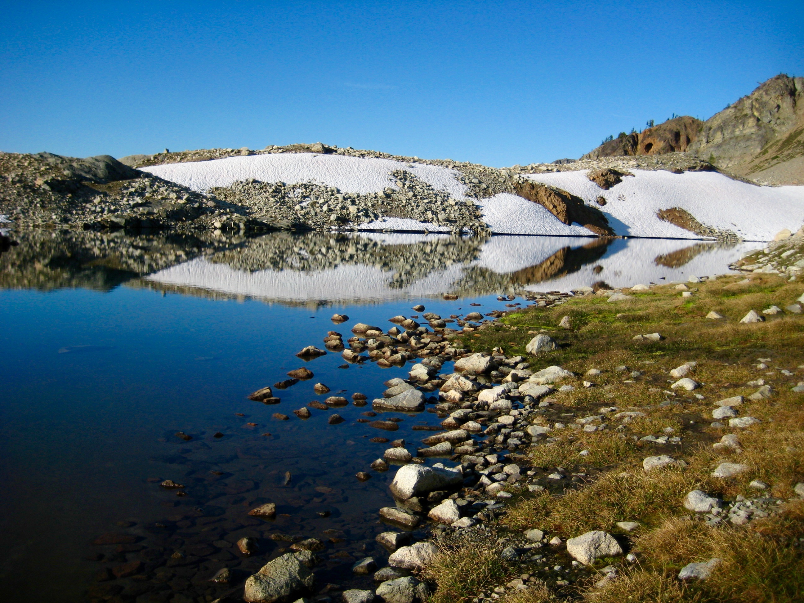 Snow patches on the Upper Silent Lake shoreline