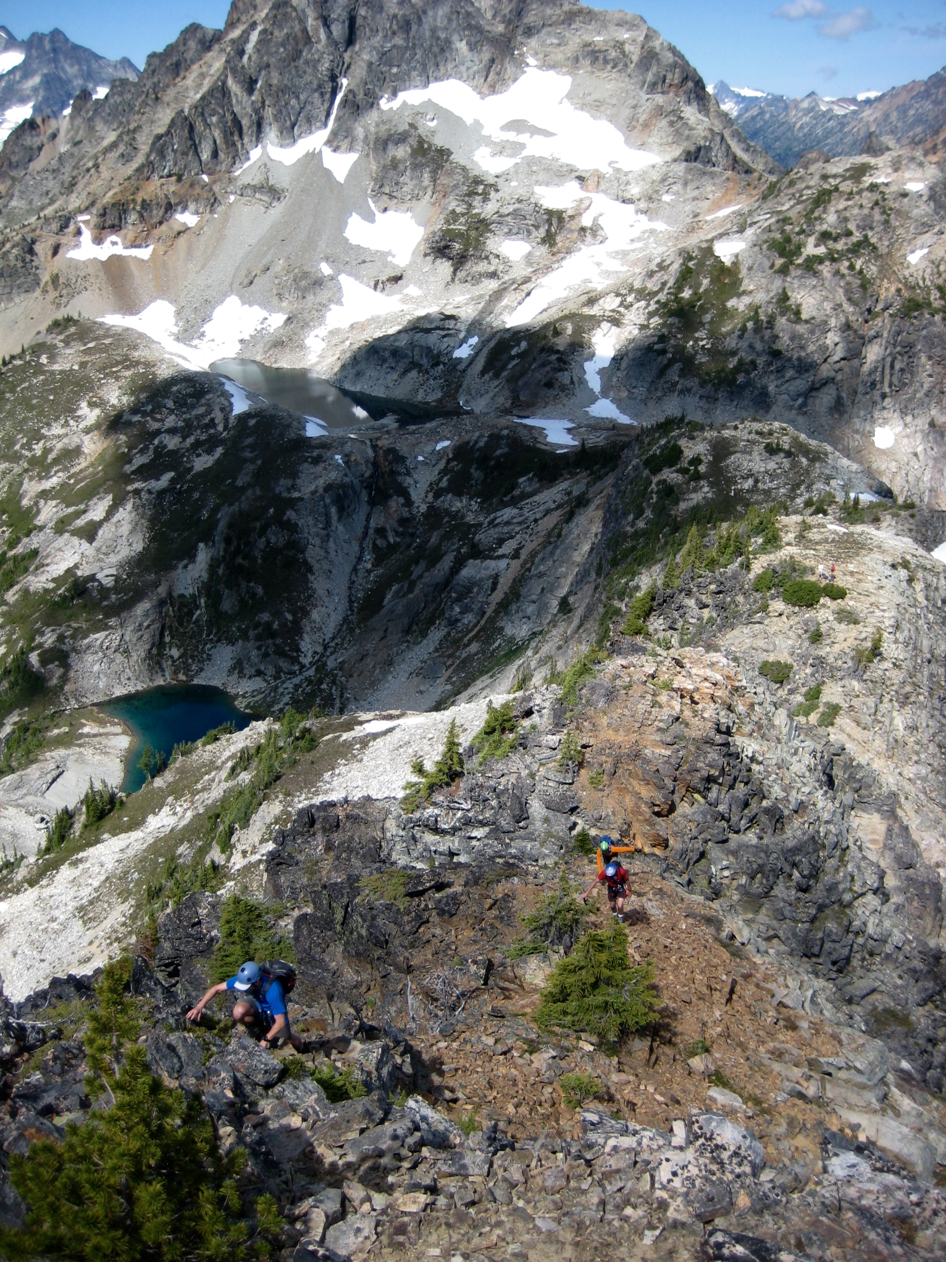 Climbers scrambling up the West Ridge of Fisher Peak