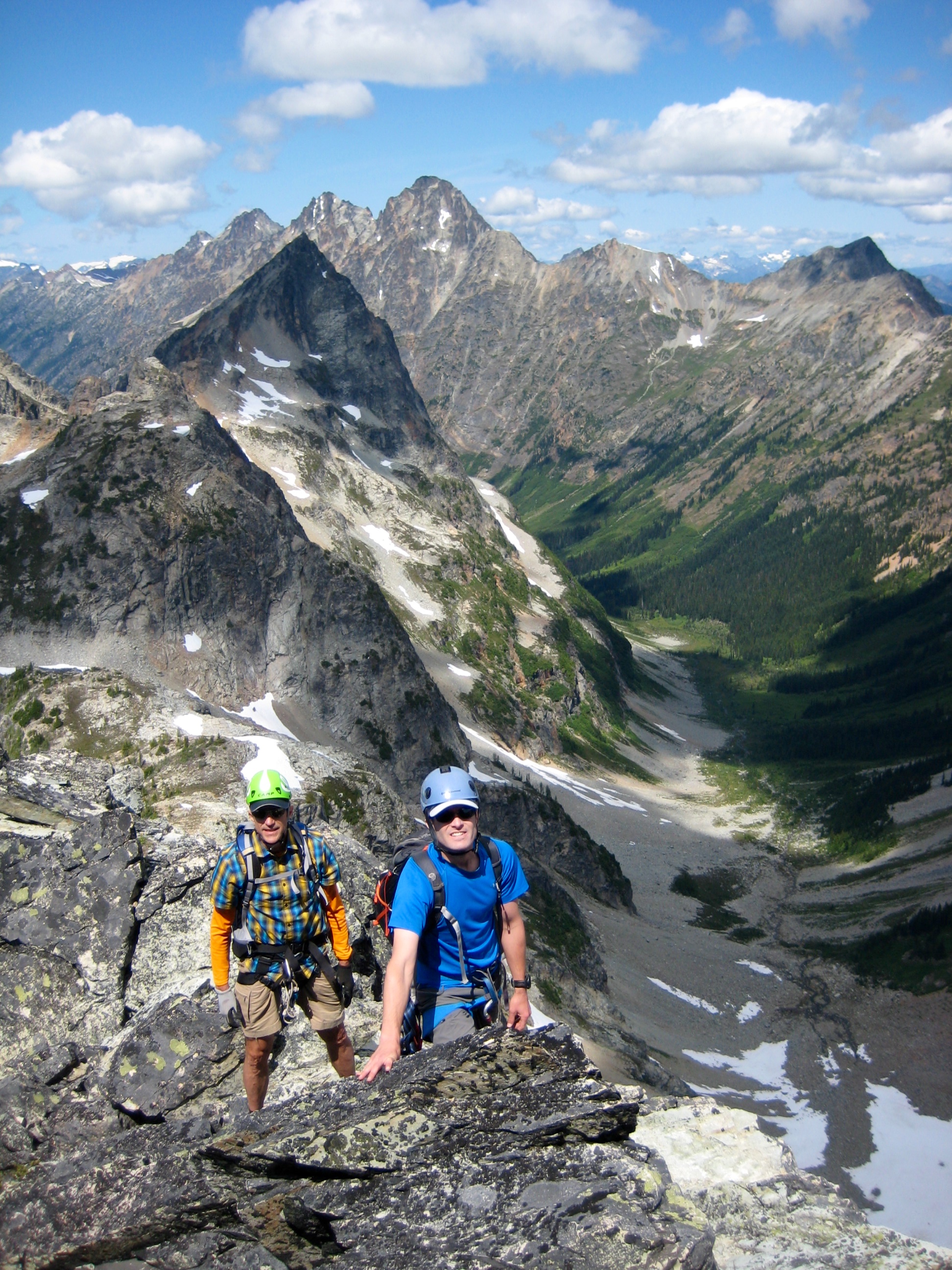 Climbers scrambling On Northwest Ridge Of Fisher Peak with Ragged Ridge