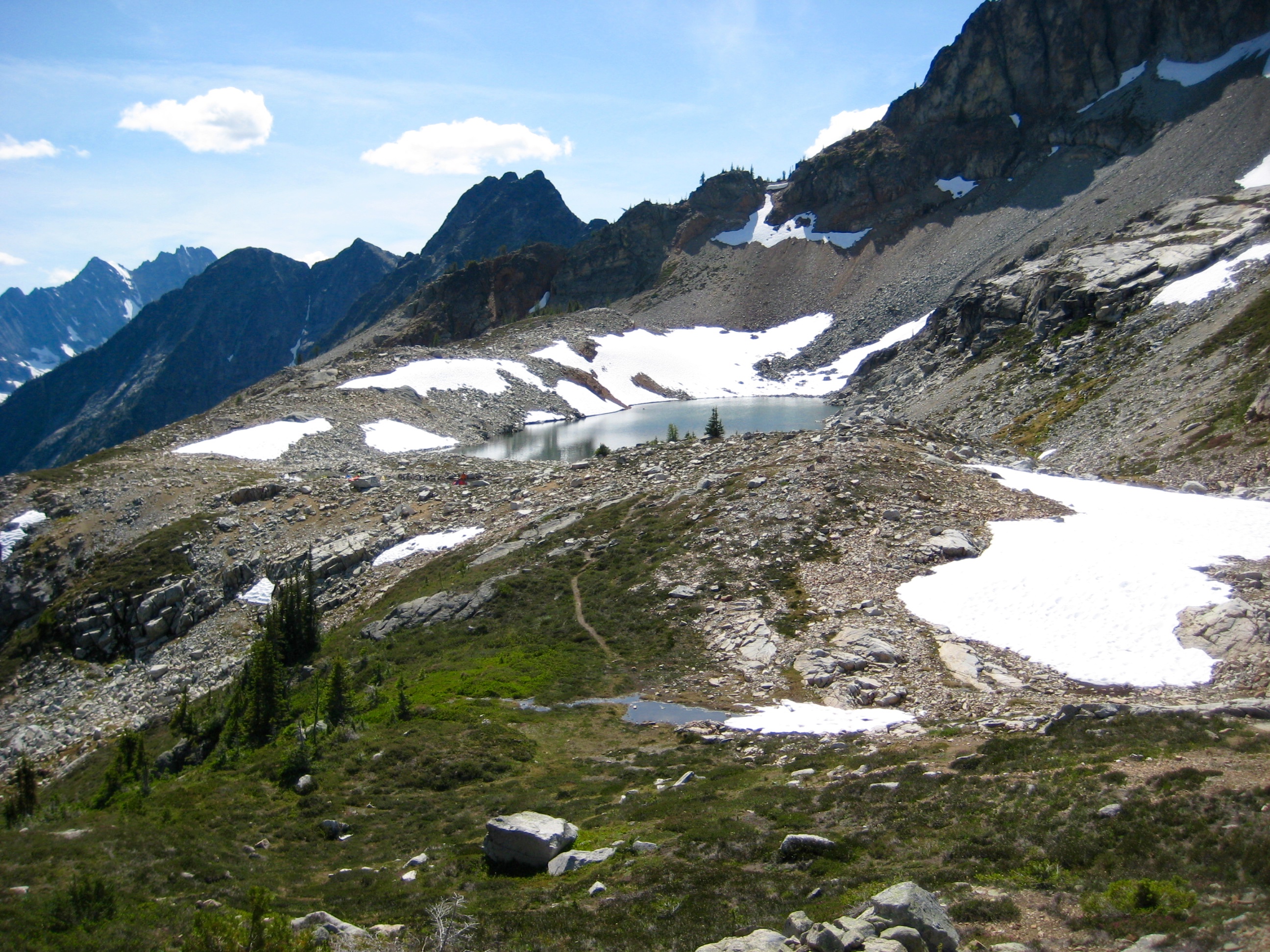 Upper Silent Lake with snow patches From Silent Pass