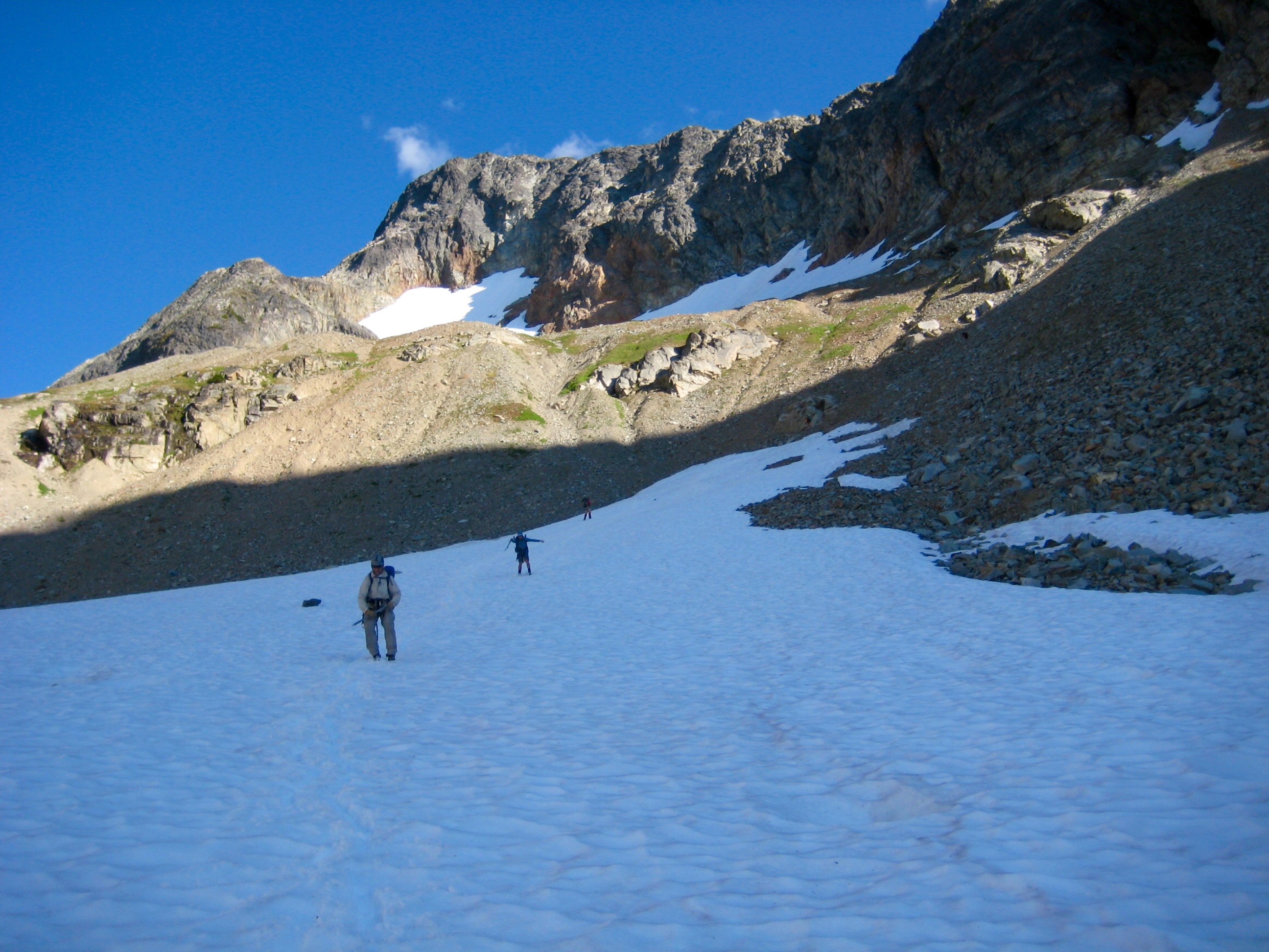 Climber Glissading Down Fisher Peak Snow Patch To Fisher Overlook Camp