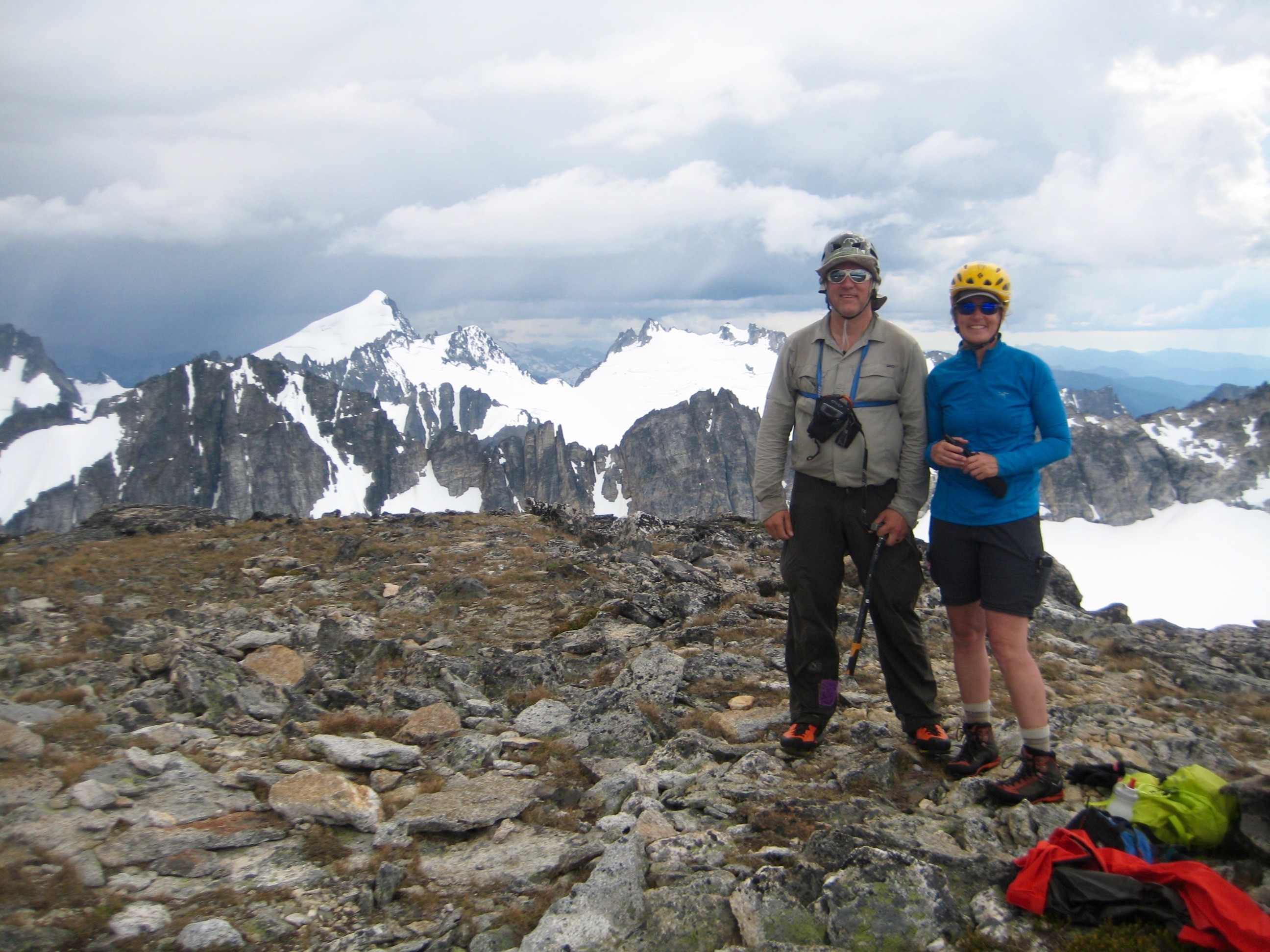 Mountain climbers standing on the summit of Primus Peak with Inspiration Traverse in background