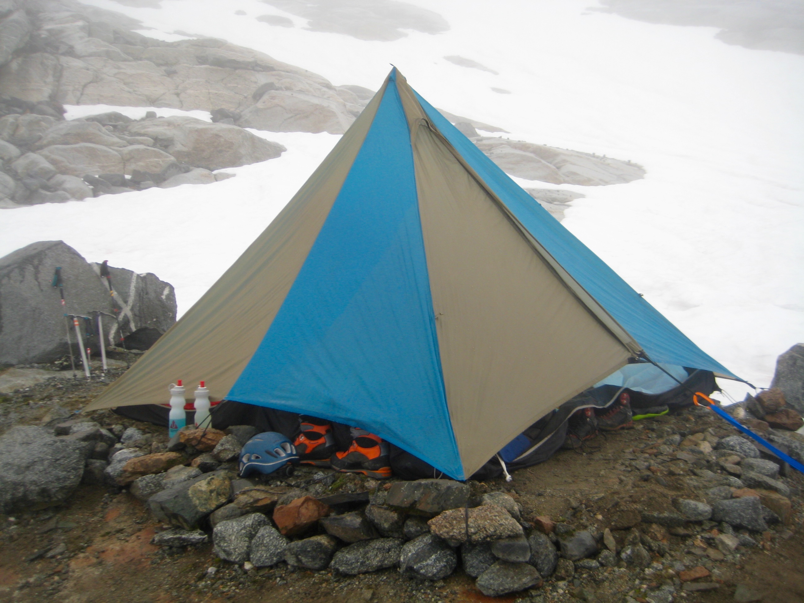 mountain climber's tent on moraine with snow fields in the background on McAllister Traverse aka Isolation Traverse