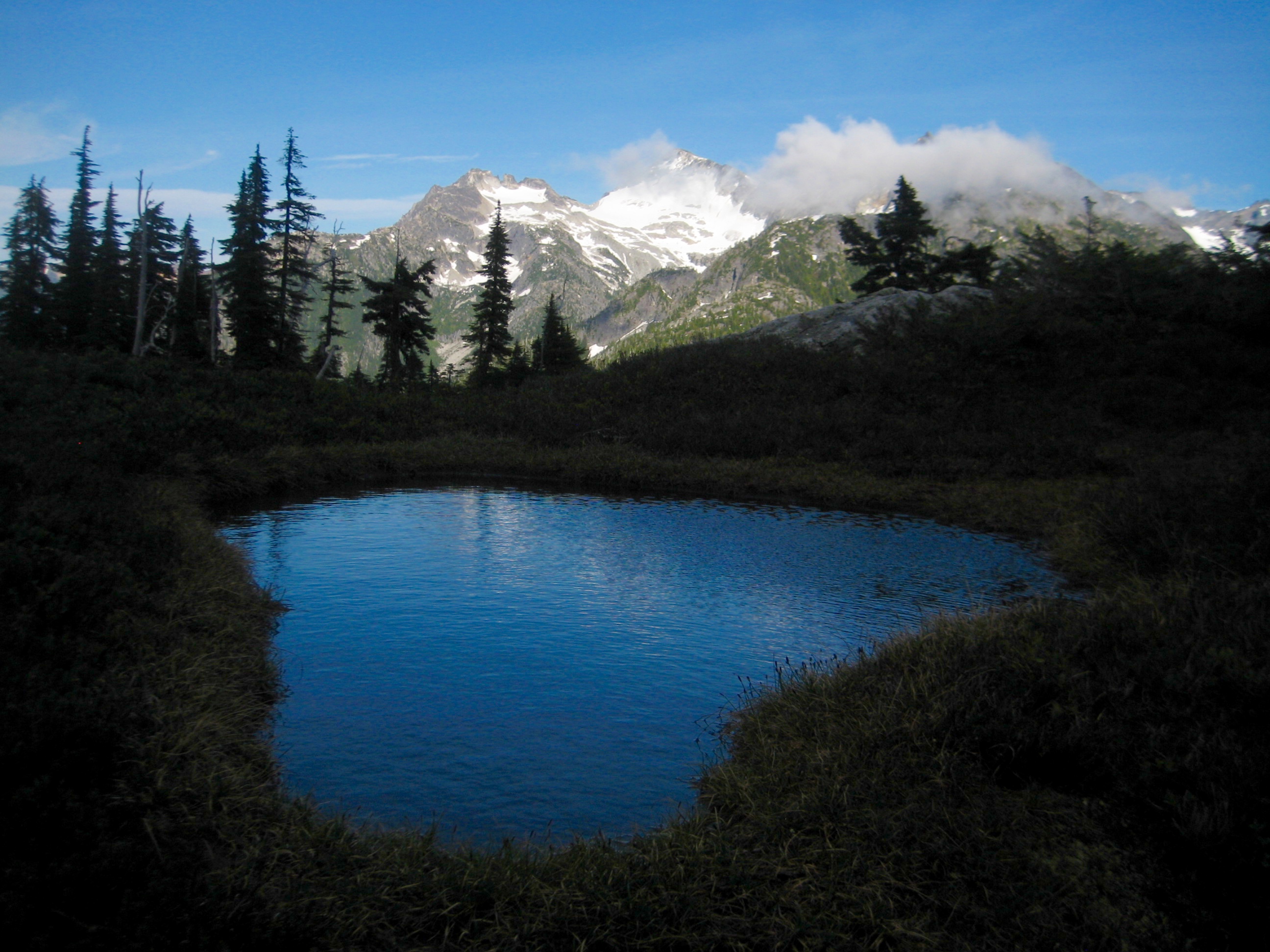 eveing light on Primus Peak with WIlcox Tarn in the foreground on the Isolation Traverse in the North Cascades