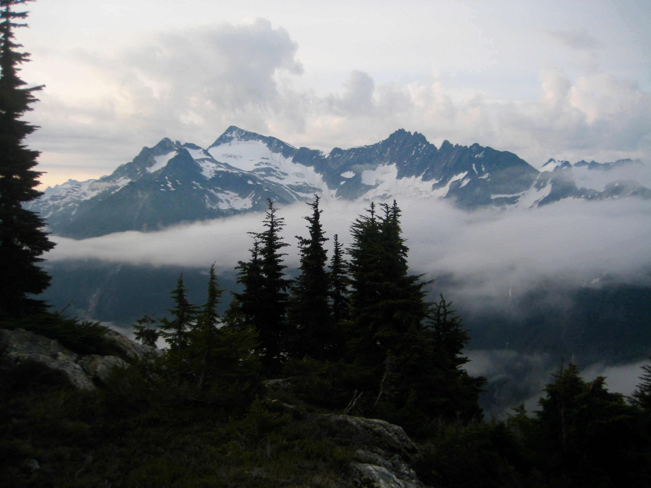 morning light with rising fog below Primus Peak and Tillies Towers on the Inspiration Traverse in the North Cascades