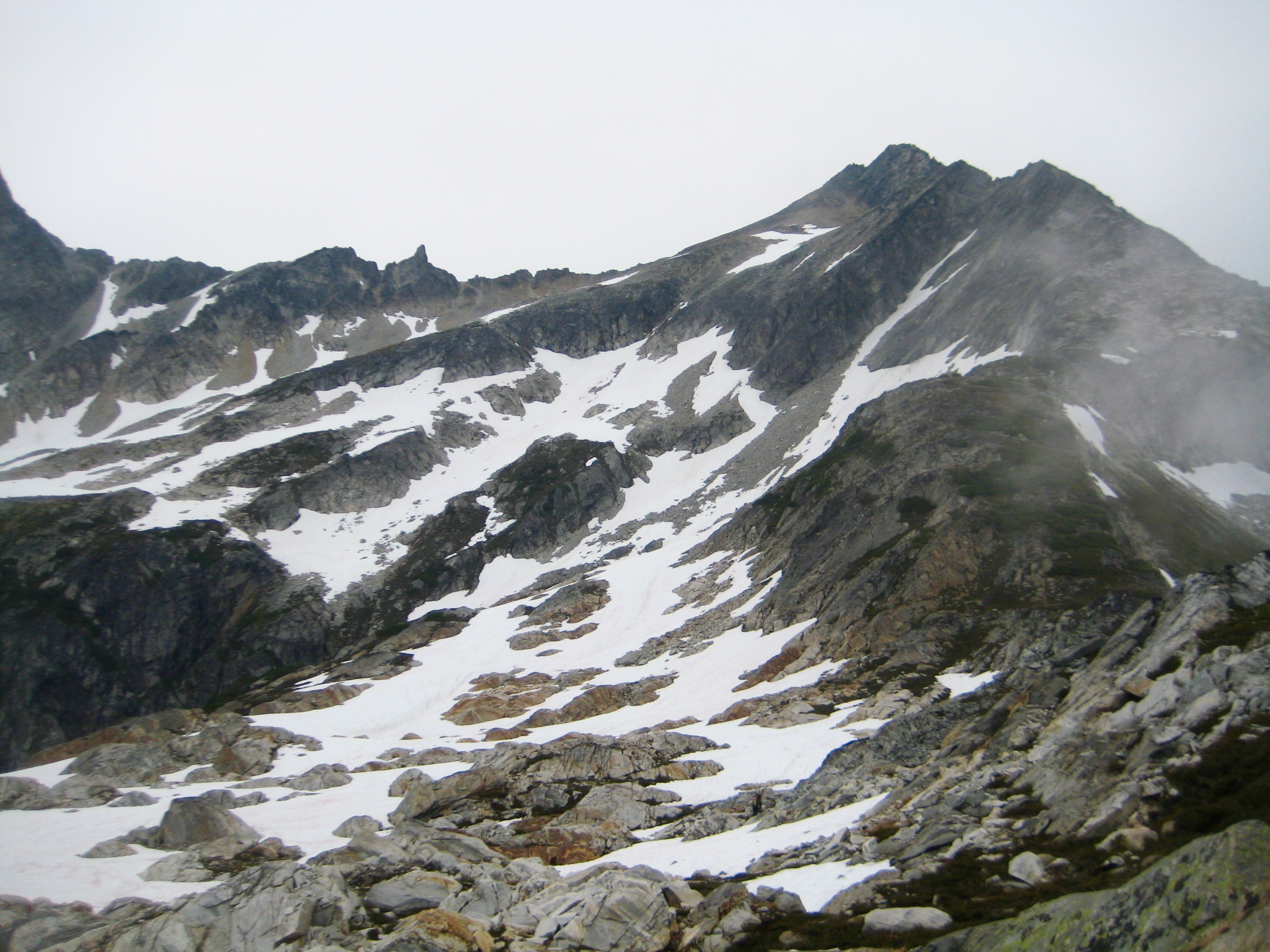 Snowfield Peak with linguring snow patches as seen from the Isolation Traverse in the North Cascades