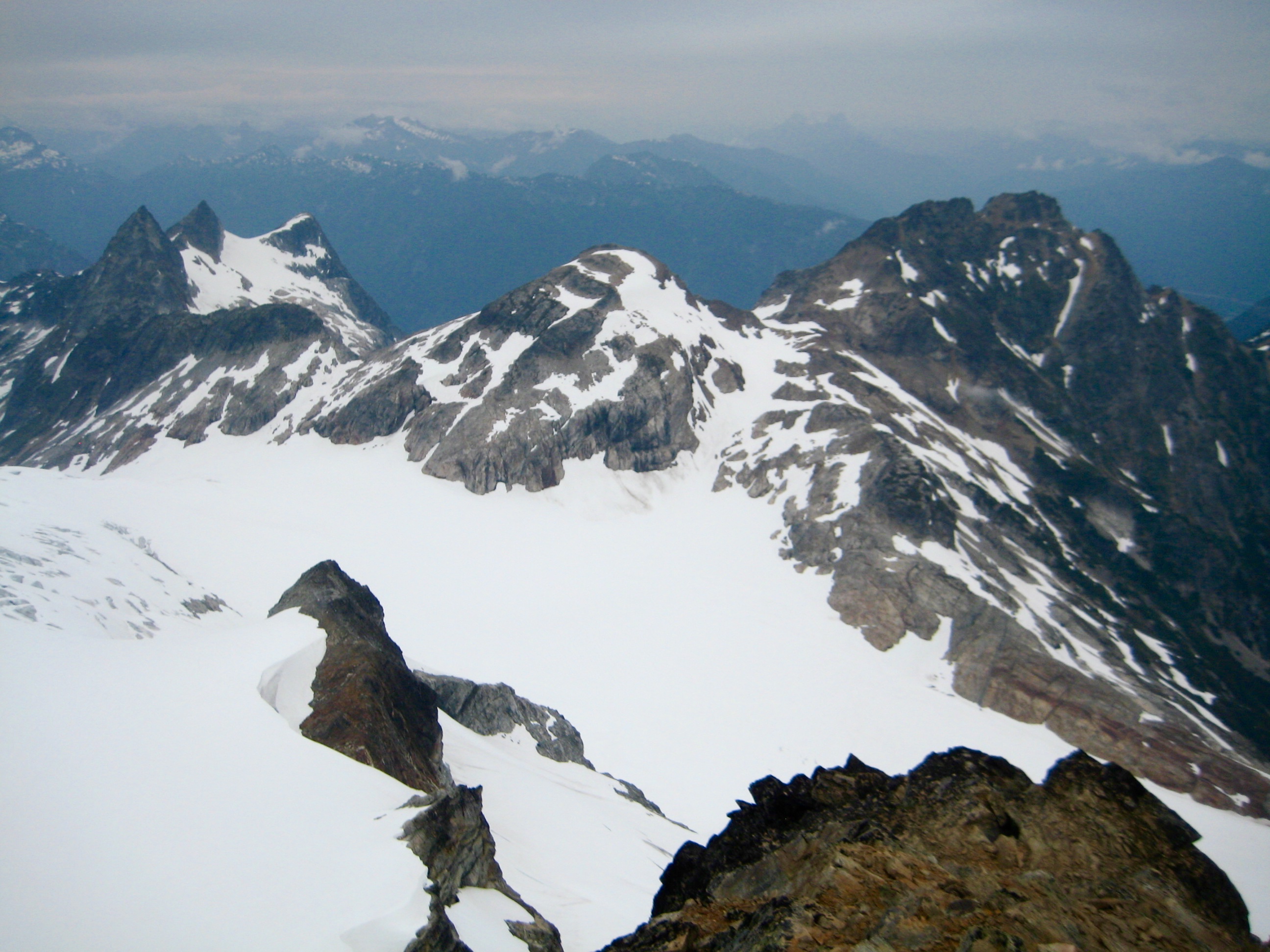 Paul Bunyans Stump and Colonial Peak in the North Cascades as seen from the summit of Snowfield Peak along the Isolation Traverse