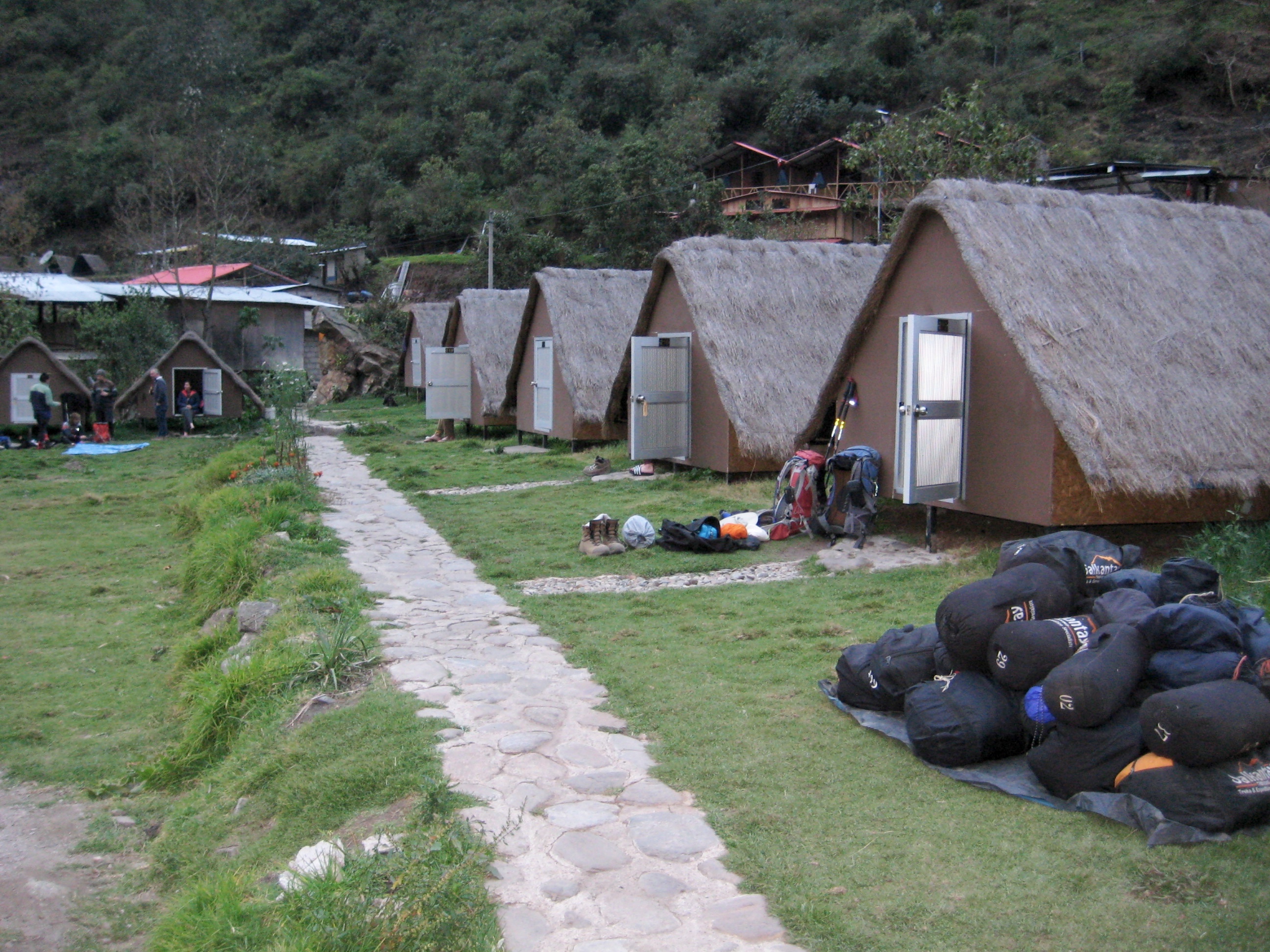 Chaullay Andean Huts with stacks of trekker bags
