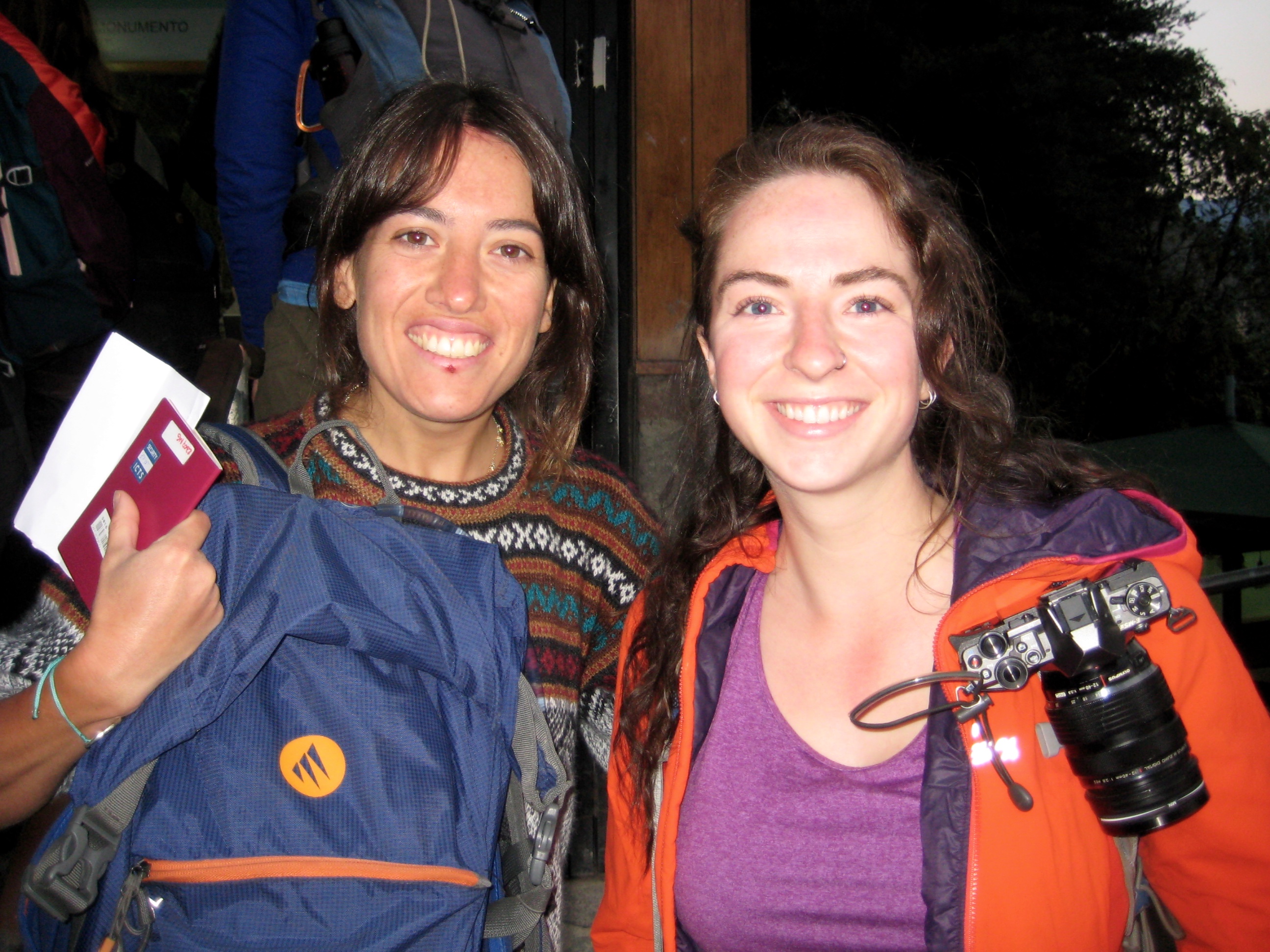 trekkers at the top of trail leading to the gates of Machu Picchu in the dark