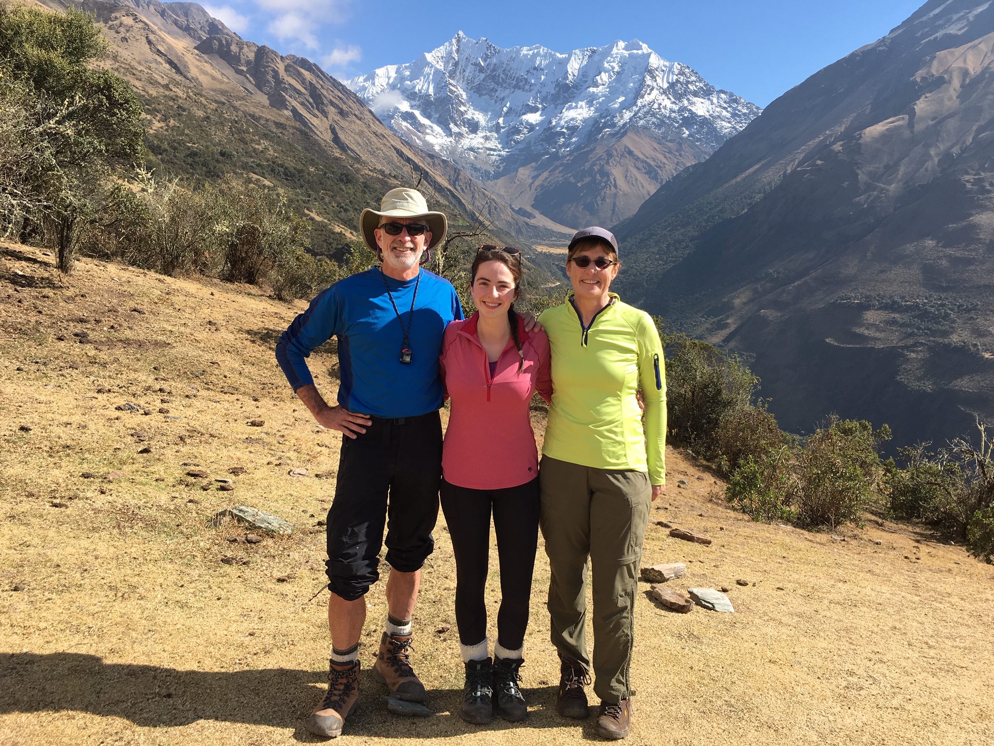Trekkers at the start of the Salkantay Trek with snow covered mountains in the background