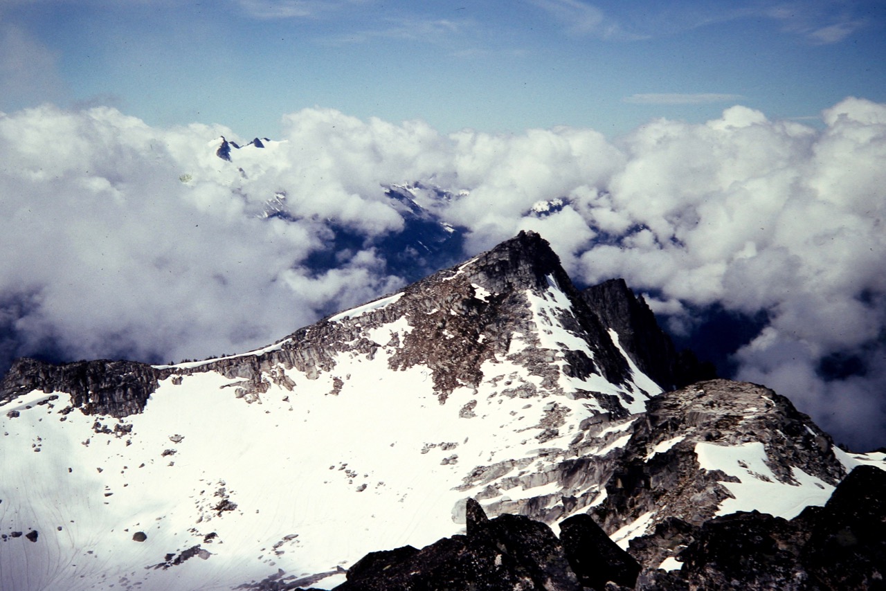 Clouds swirl around Hidden Lake Peak Lookout in the North Cascades