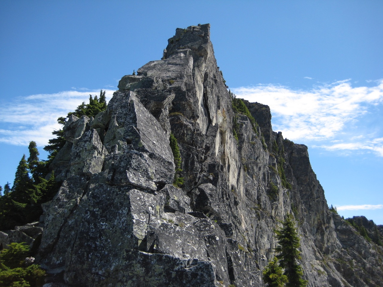 Sharply pointed Lundin Peak juts into a blue sky