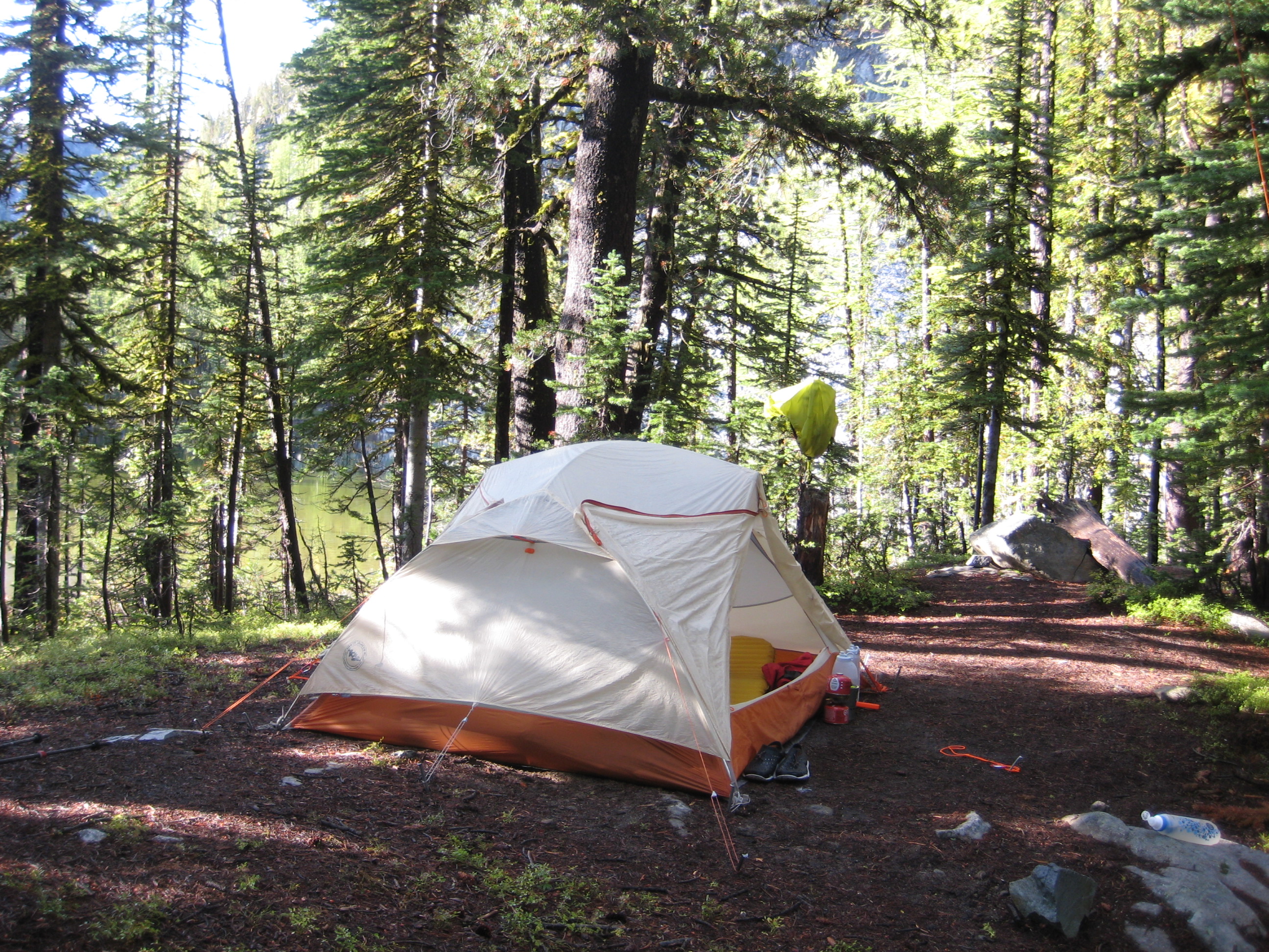 climber camp with tent in the forest next to Lower Martin Lake in the Sawtooth Mountains