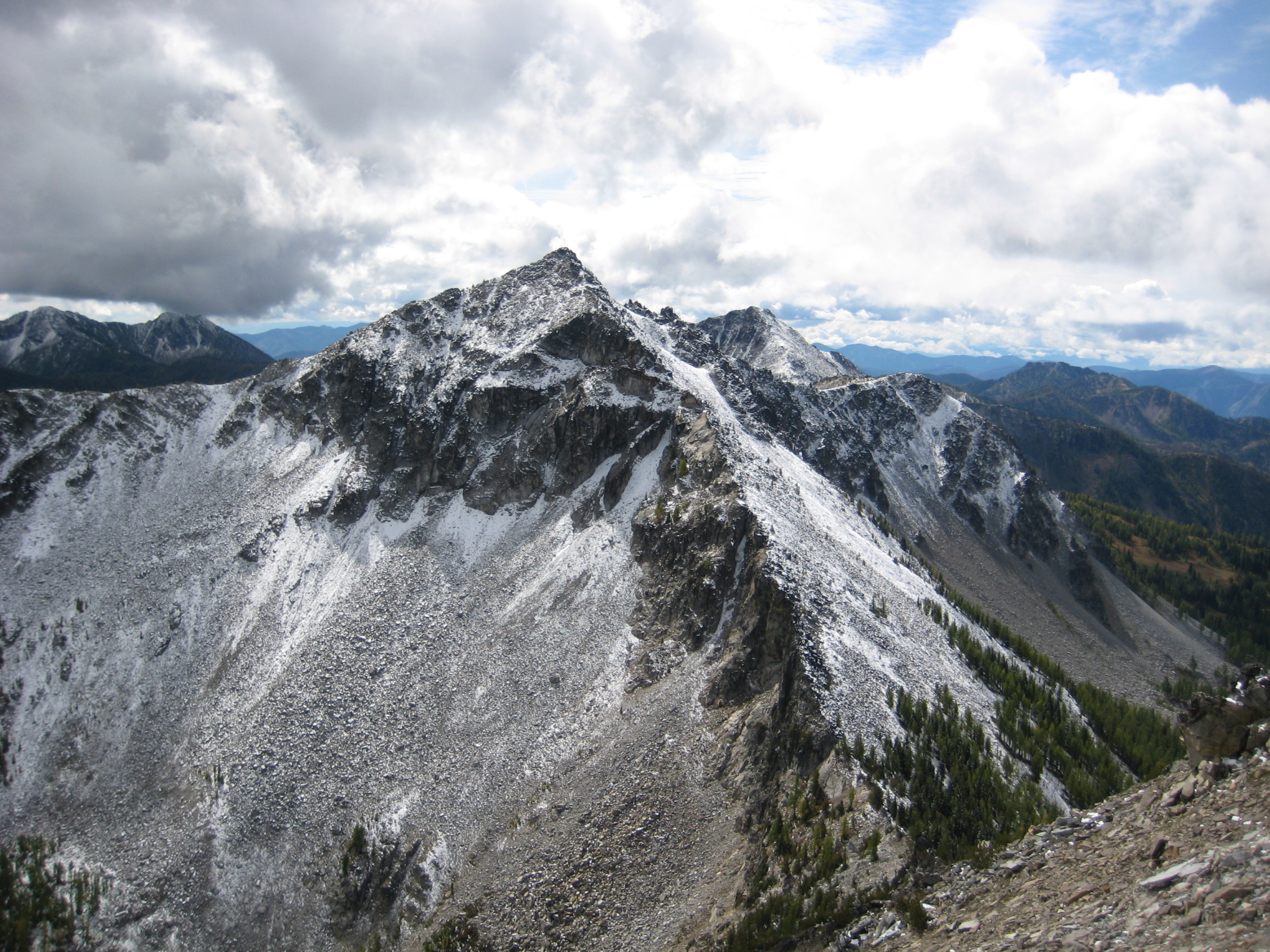 snow dusting on Martin Peak with storm clouds as seen from Cheops Peak in the Sawtooth Mountains