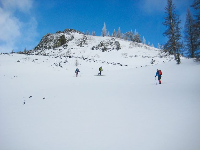 skiers skinning up Windy Hollow snowfield below Windy Knob on the first half of the Tronsen Head Ski Loop