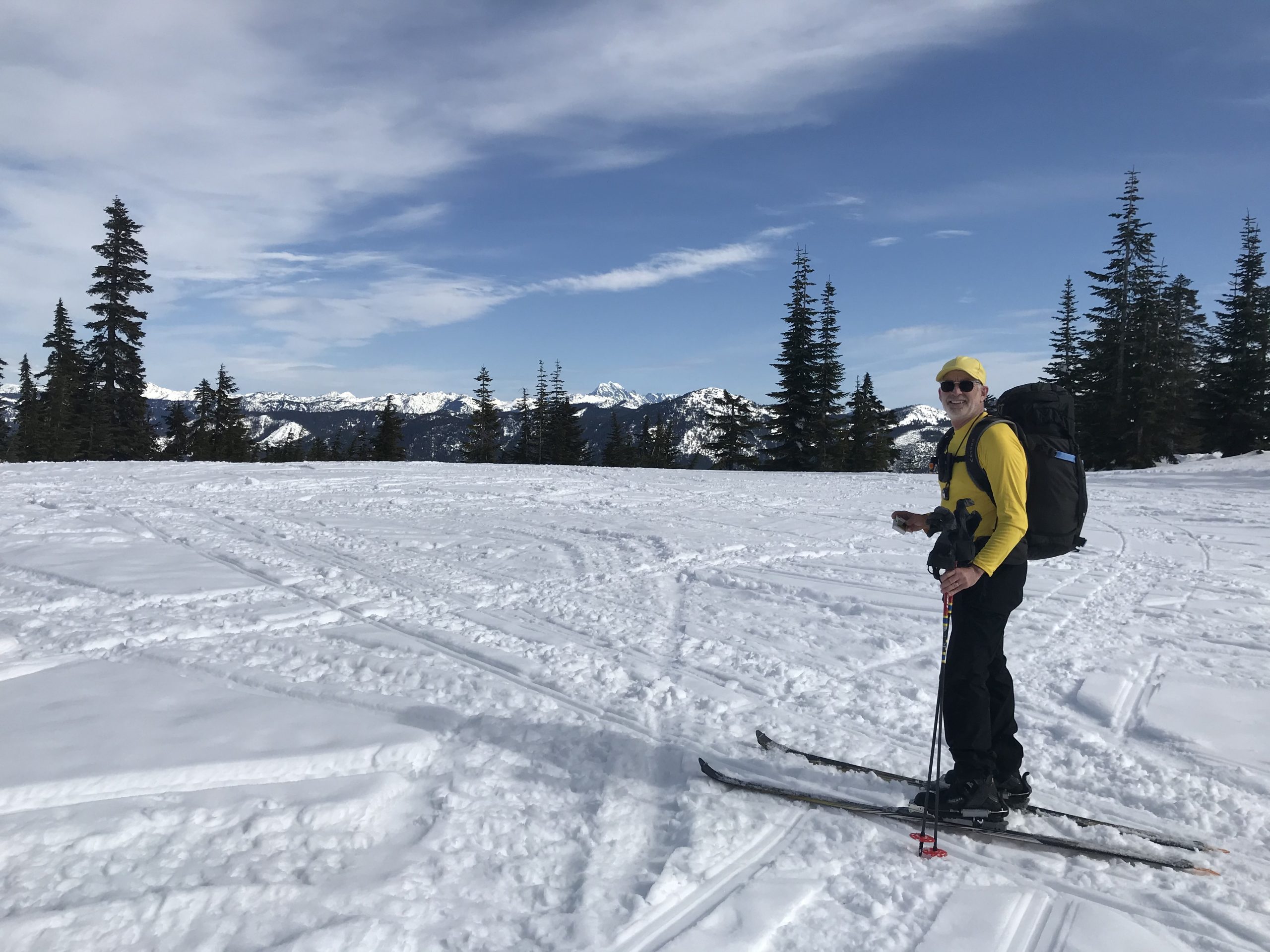 Jim skiing up to Keechelus Tower Knoll on skis in the Keechelus Mountains