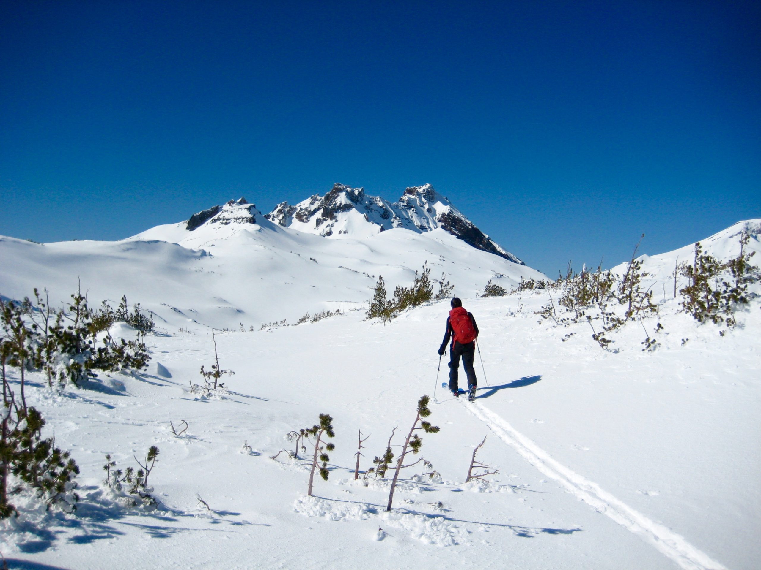 Skier heading out toward Broken Top from Tam RIm