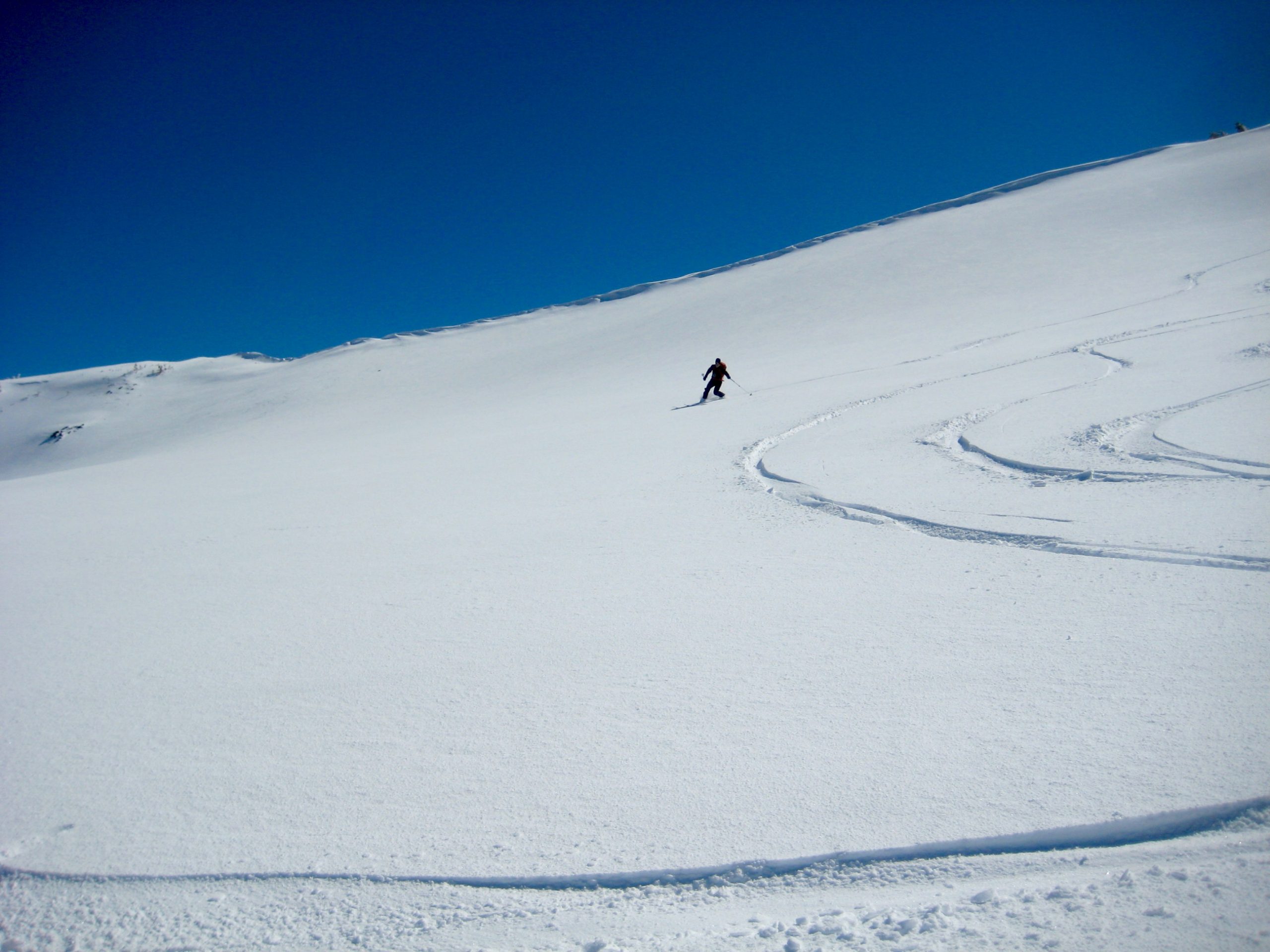 Telemarking down Snow Creek Bowl under Tam Rim