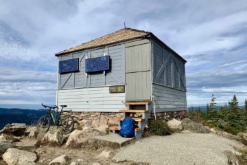 An old fire lookout cabin sits on the summit of Sun Top in the Clearwater Mountains