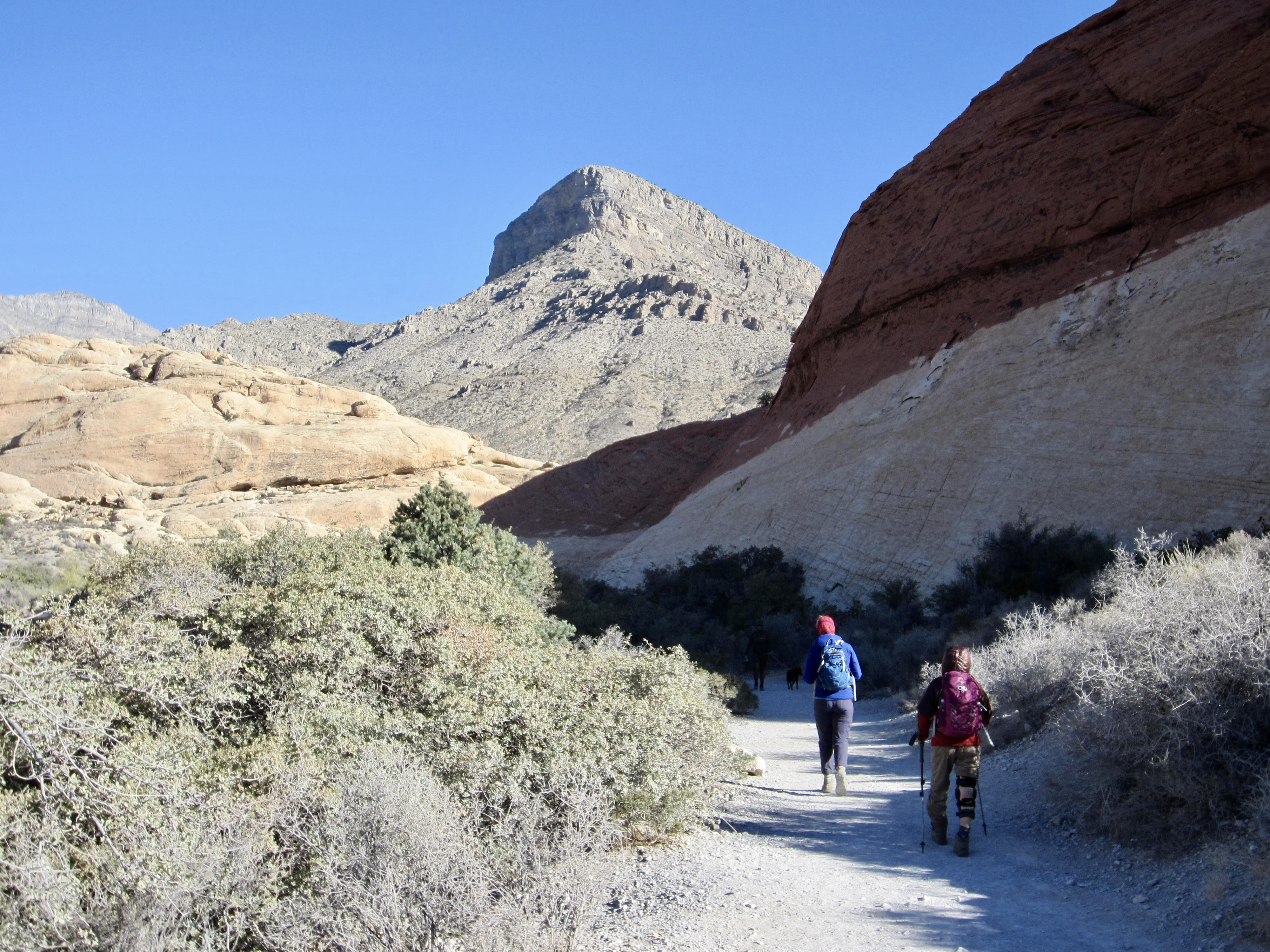 Two hikers approach Turtlehead Peak in Red Rock Canyon, Nevada