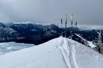 A pair of skis stand atop Dungeon Point near Snoqualmie Pass, WA.