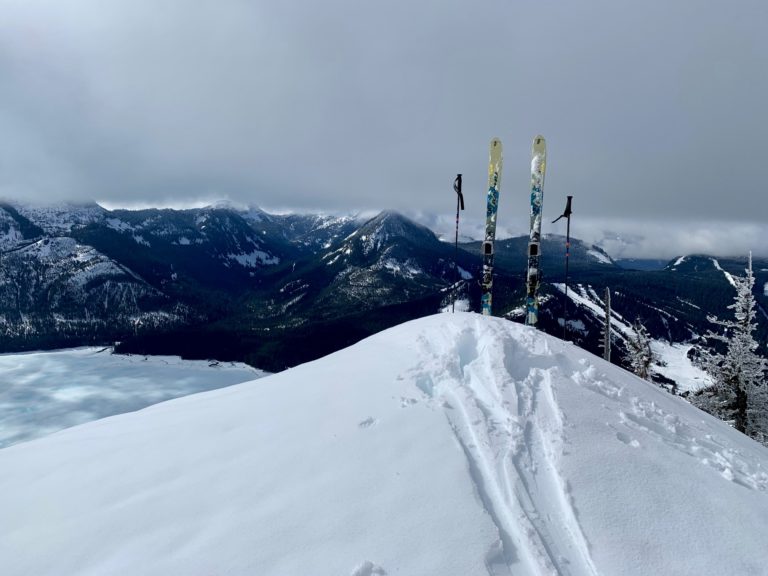 A pair of skis stand atop Dungeon Point near Snoqualmie Pass, WA.