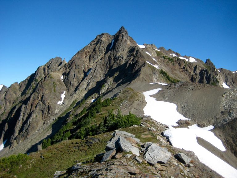The southeast ridge of Mt Meany in the Olympic Mountains sweeps upward to meet the sharply pointed summit horn
