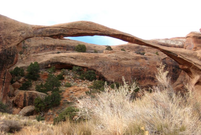 The slender span of Landscape Arch as seen from the Devils Garden Loop Trail in Arches National Park