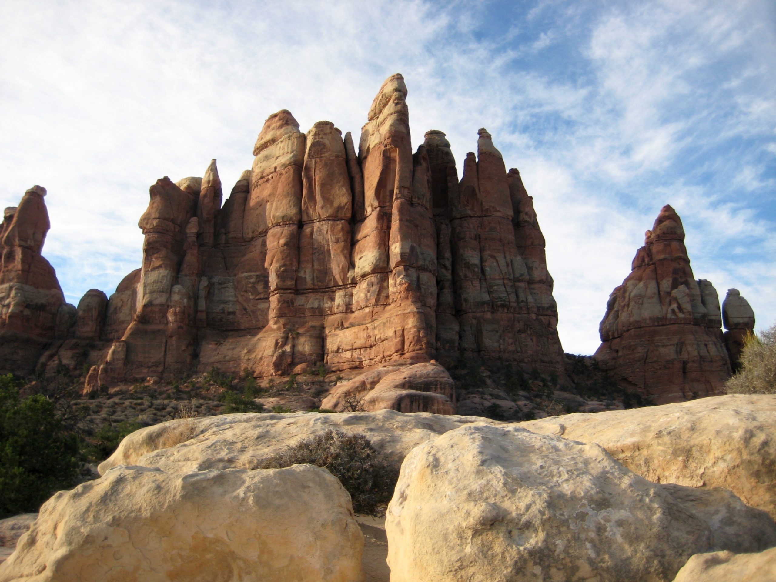A natural sandstone castle stands on a ridge between Elephant Canyon & Chesler Park in the Needles District of Canyonlands National Park