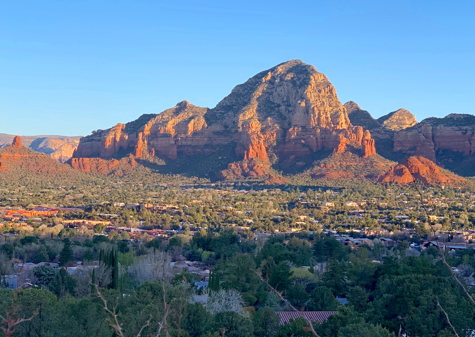 Morning sun lights up rocky Capitol Butte in Sedona, Arizona.