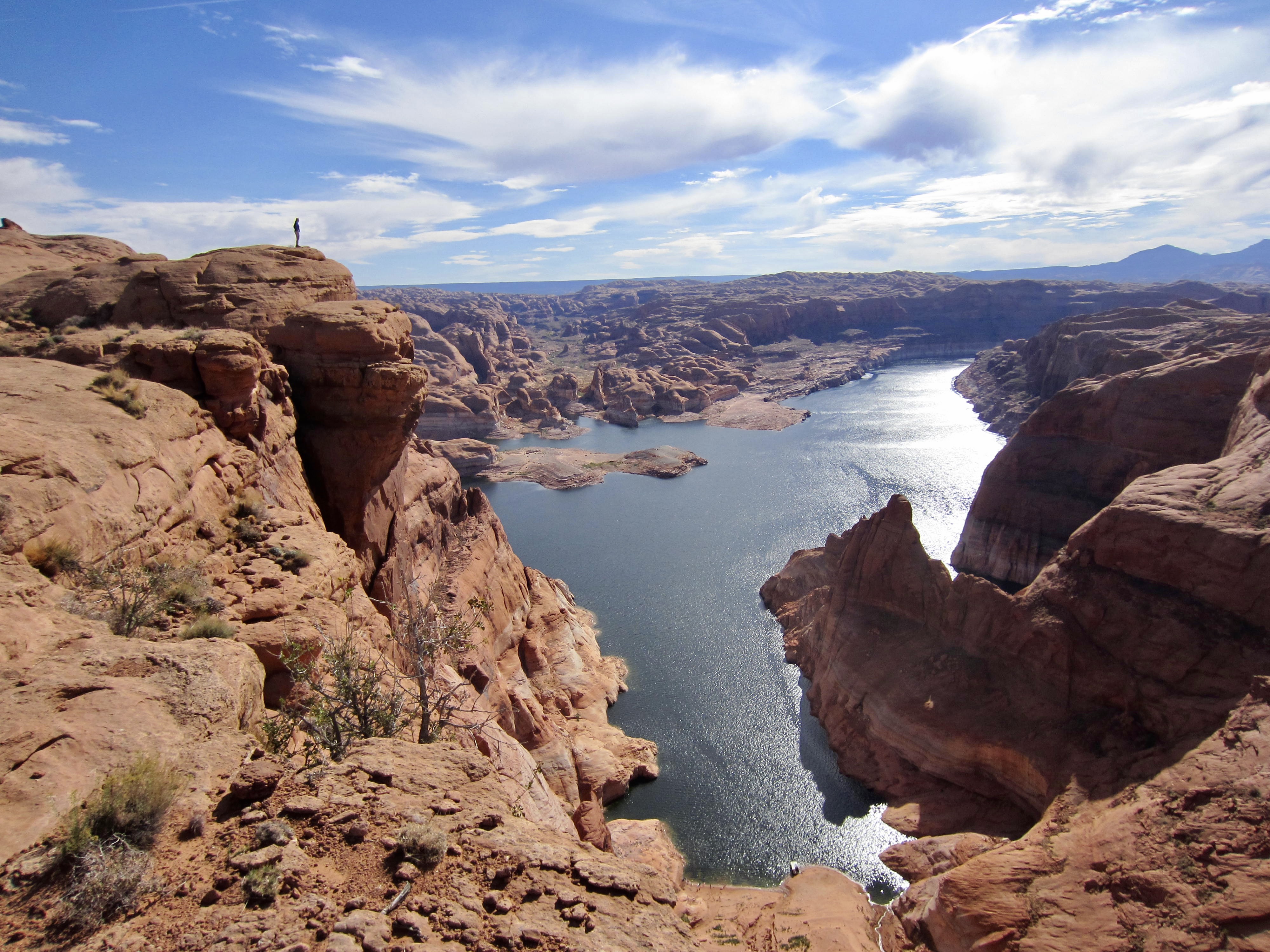 The blue waters of Lake Powell can be seen through a narrow canyon called Hole-in-the-Rock located in southern Utah