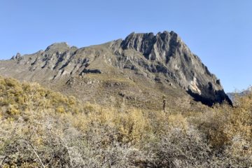 The summit of rocky El Toro stands above the arid slopes of Potrero Chico