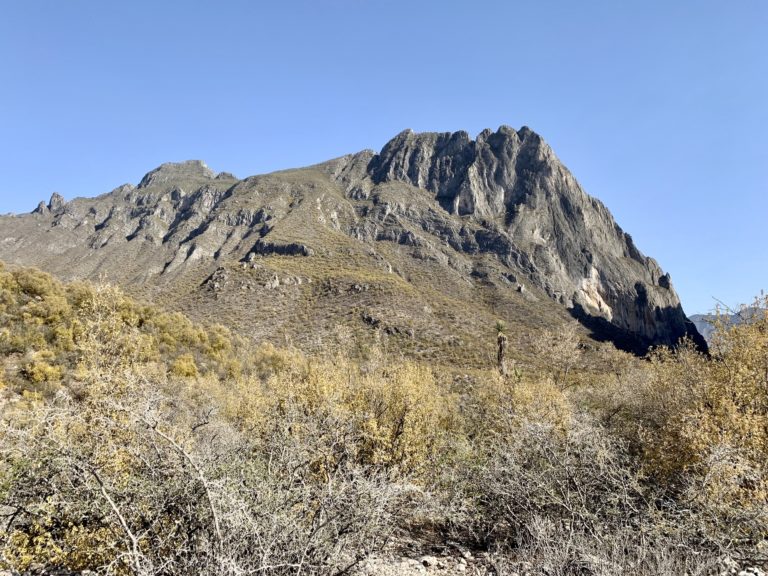 The summit of rocky El Toro stands above the arid slopes of Potrero Chico
