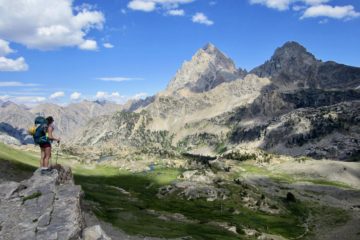 A hiker gazes at Grand Teton from Hurricane Pass during the Teton Crest Trail Traverse in Wyoming