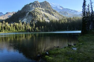 Mount Rainier & Mineral Mountain stand behind Mystic Lake on the Northern Loop Trail in Mount Rainier National Park