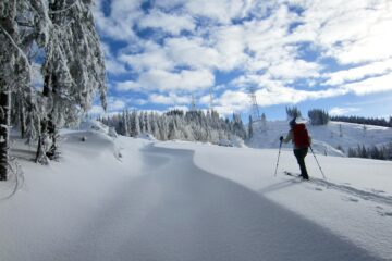 A backcountry skier approaches West Rattlesnake Peak in the Issaquah Alps, WA.